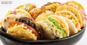 Various stuffed arepas in foreman grill
